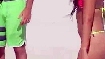 Young girl in micro bikini enjoys beach day with boyfriend's relatives