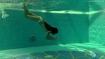 Irina Russaka Bathes Underwater In Pool, Showing Small Tits.