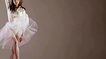 Blonde gymnast just casually showing off moves in a naked workout.