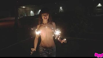 Just chilling topless outdoors with Honey Gold and Dakota Marr flashing sparklers.