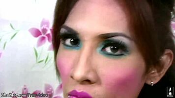 Watch this pretty ladyboy tease her small tits and shaved cock in lingerie.