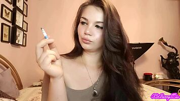XO Bunny blows smoke in your face while smoking her cigarette.