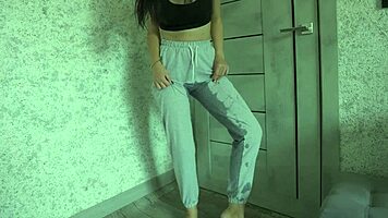 Petite teen experiences desperation pee in homemade video