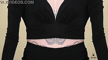 Check out Kit Summers in her two-piece black outfit with deep plunging neck!