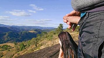 Tourist guide reveals his big cock to the pretty visitor on the mountain.