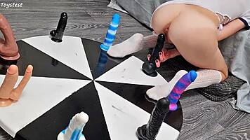 Petite girl wins orgasm playing wheel of dildos