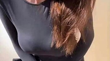 woman caresses her milky tits until she orgasms
