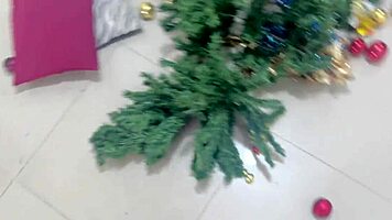 Busty young woman gives new year gift to old man.