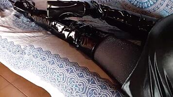 brunette milf in total black fishnets pantyhose and over the knee boots