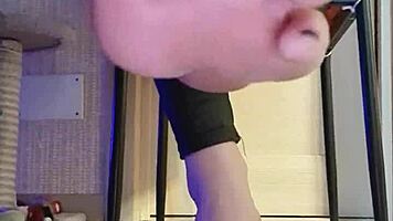 Woman in Black Leggings Teases with Subtle Fingering