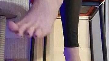 Woman in Black Leggings Teases with Subtle Fingering