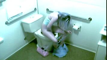 Hot blonde office babe fingers herself wildly on hidden toilet cam