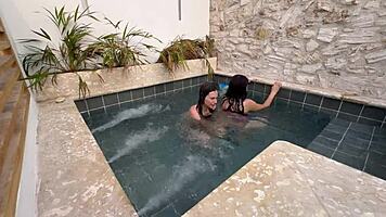 Two horny Colombians finger wet pussies publicly at pool risking exposure