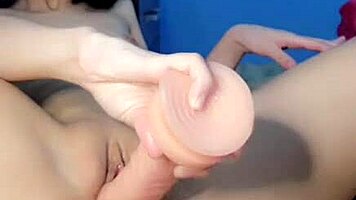 neko girl double penetrates with sex machine in bath