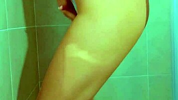 College stunner slips off Brazilian thong in steamy shower tease