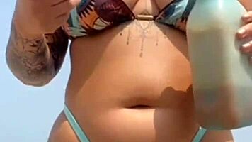 found this babe beach let him rub oil swollen pussy lips