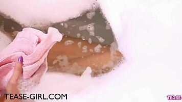 Blonde milf model bathes sensually on sofa