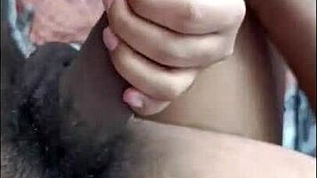 desi hottie strokes cock with feet while buzzing on bed