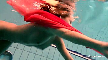 silvie dives in pool showing off her big tits and hairy pussy