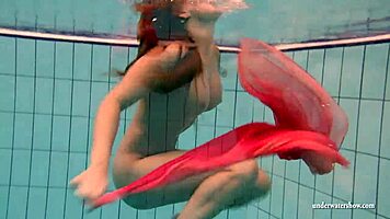 silvie dives in pool showing off her big tits and hairy pussy