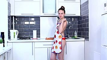 young cutie fingers her wet hairy pussy hidden under thick never-shaved bush in kitchen