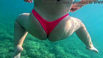 Pawg slips into thong bikini for underwater swim bath in crystal waters