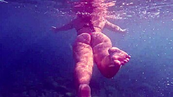 Pawg slips into thong bikini for underwater swim bath in crystal waters