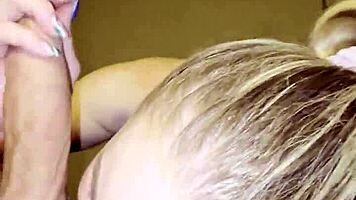 Blonde milf kneels to please young stud with sloppy blowjob