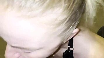 Blonde milf kneels to please young stud with sloppy blowjob