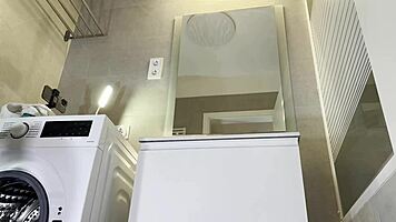 alicia poses in plaid skirt and stockings bathroom