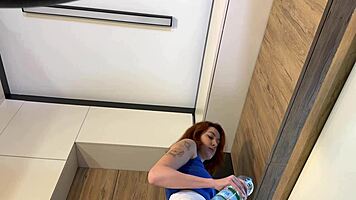 redhead girlfriend models new white miniskirt and pink panties before stripping