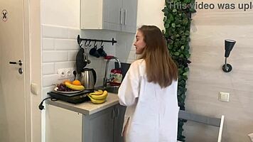 banana slips deep into her solo kitchen masturbation