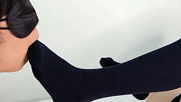 cute uniform girl in navy socks delivers teasing footjob to fetish slave