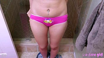 Fierce brunette stunner slips into steamy shower seduction