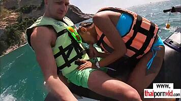 thai teen girlfriend deepthroats boyfriend's monster cock outdoors