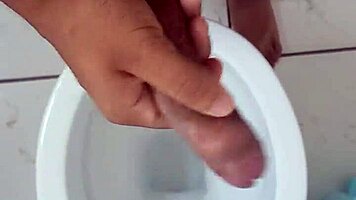 Brazilian solo ass tease handjob strokes huge cock in bathroom mirror