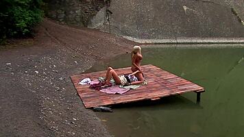 gorgeous young babes share sensual outdoor pussy play by lake