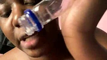 ebony beauty fingers wet hairy pussy with bottle then creamy cum finish