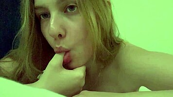 Blonde teen fingers shaved pussy to explosive hotel orgasm