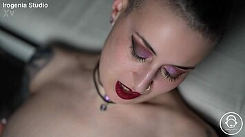 emo goth brunette strips slow revealing pierced nipples and tattoos