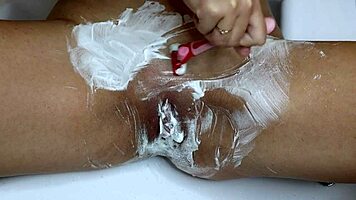 Closeup pussy shaved smooth with trimmer and razor