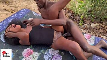 Ebony beauty shares passionate beach encounter under the sun