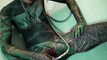 heavily tattooed model fingers her ass and squirts in shower
