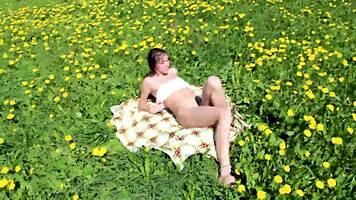 Ananta masturbates on sunny field