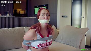 Daisy gets tied up in cheer outfit