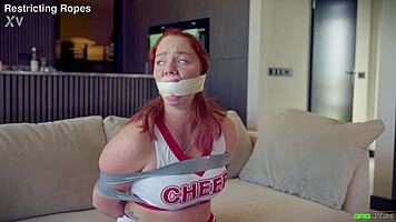 Daisy gets tied up in cheer outfit