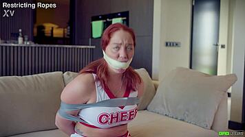 Daisy gets tied up in cheer outfit