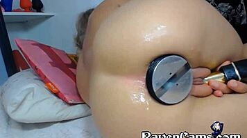 Horny performer inserts large toy into tight ass for extreme pleasure