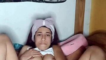 horny young 18+ woman masturbates her wet pussy with her extra large dildo