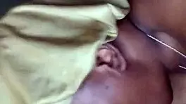 Side view of ebony bonnet working hard outdoors